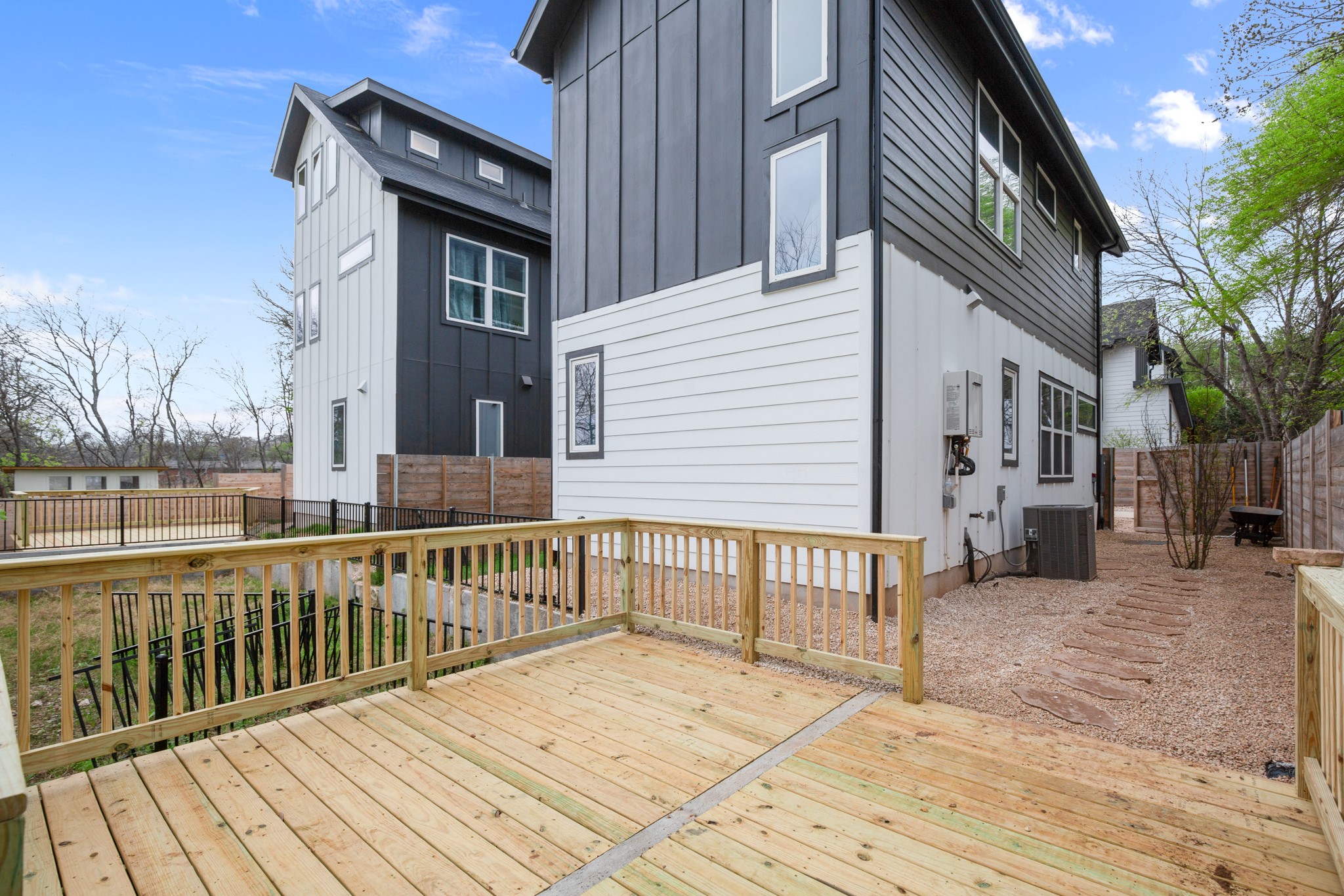 5305 Ledesma Road, Unit 4 Austin, TX 78721 - Photo 21 of 27 a view of a house with a wooden deck