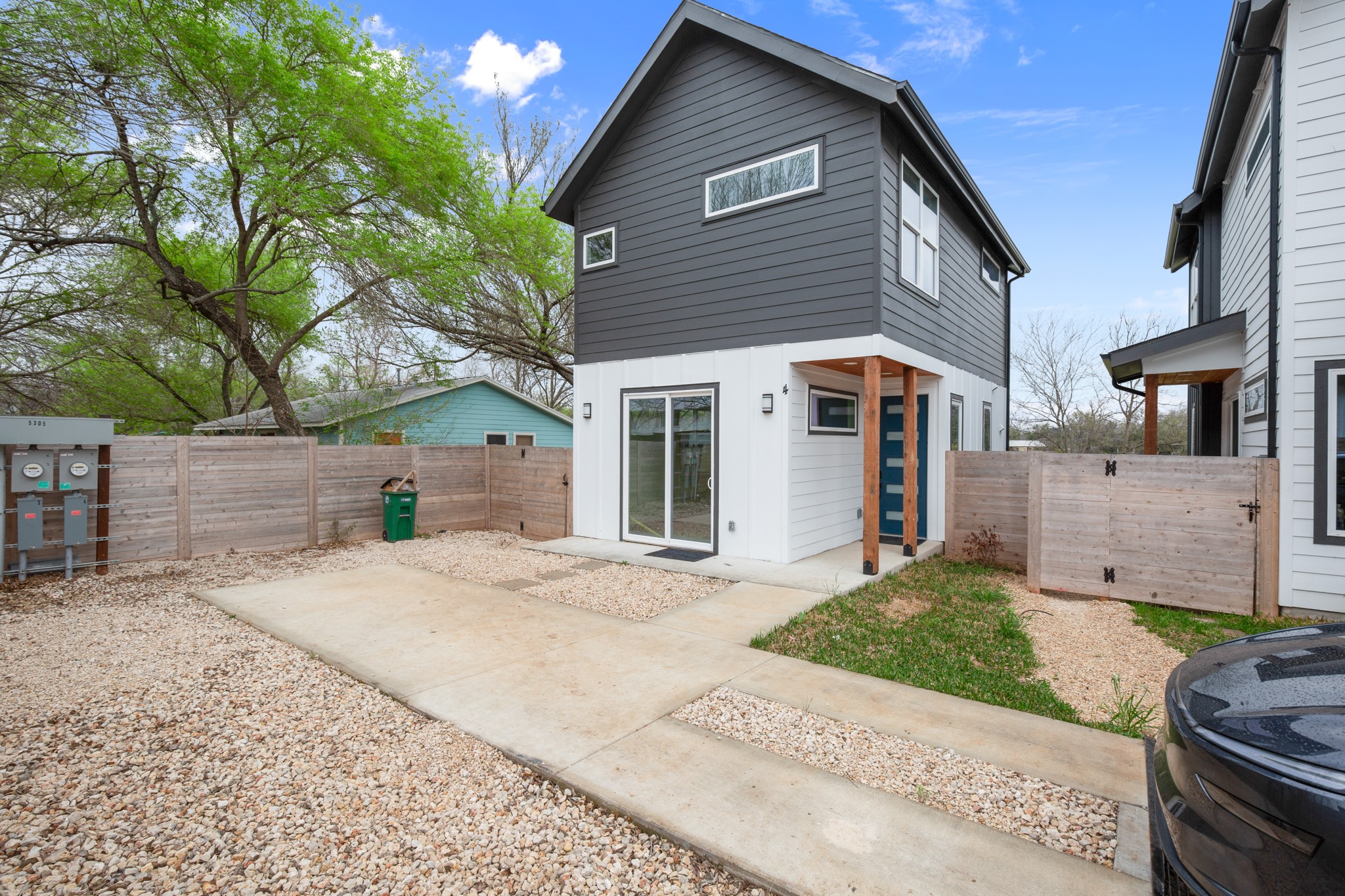 5305 Ledesma Road, Unit 4 Austin, TX 78721 - Photo 26 of 27 a front view of a house with a yard and garage