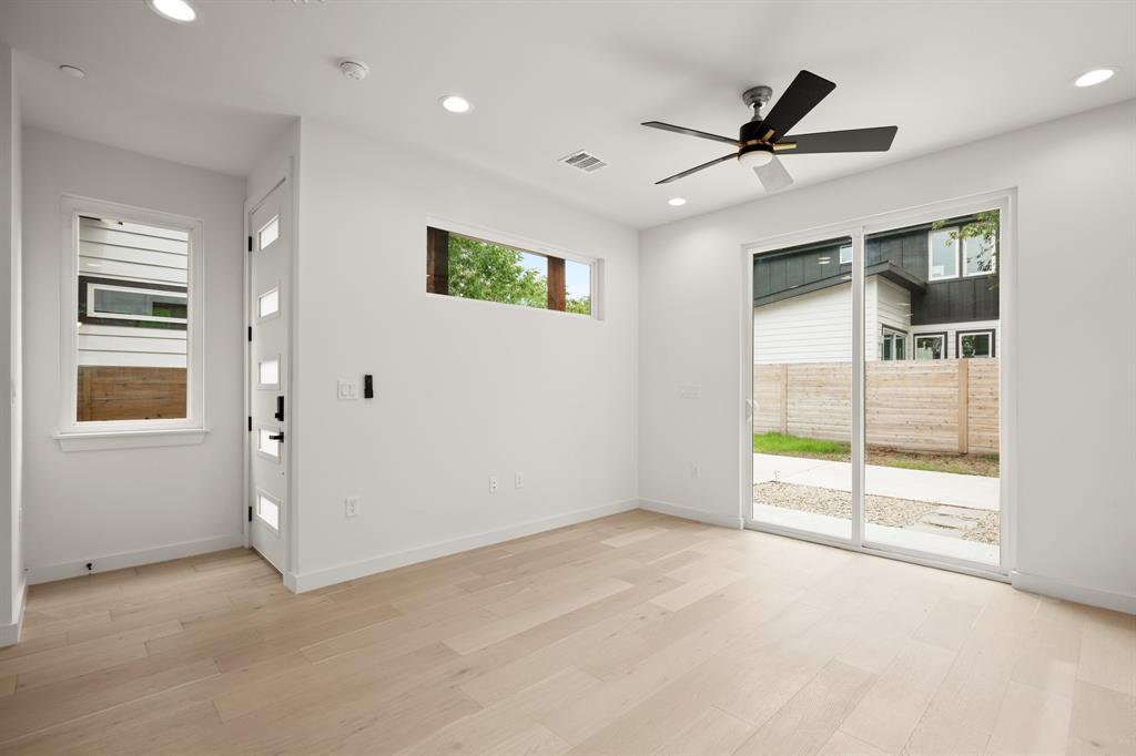 5305 Ledesma Road, Unit 4 Austin, TX 78721 - Photo 4 of 27 a view of a livingroom with a ceiling fan and window
