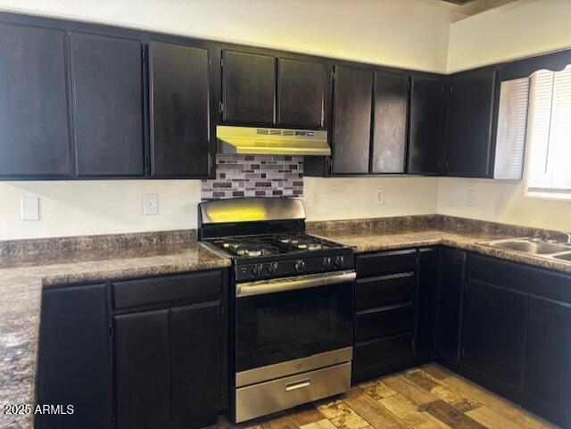 814 East 13th Street Douglas, AZ 85607 - Photo 2 of 14 a kitchen with granite countertop a stove a sink and a cabinets