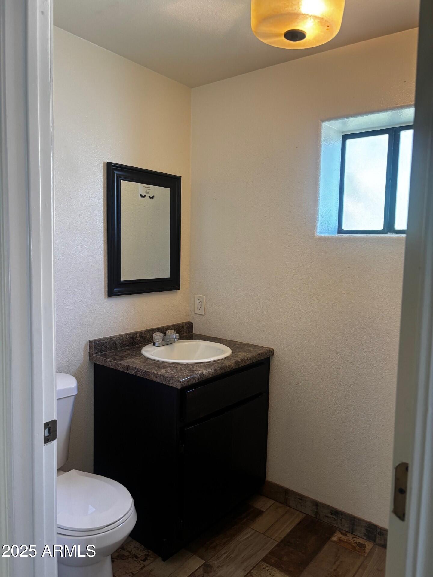 814 East 13th Street Douglas, AZ 85607 - Photo 9 of 14 a bathroom with a sink and a toilet