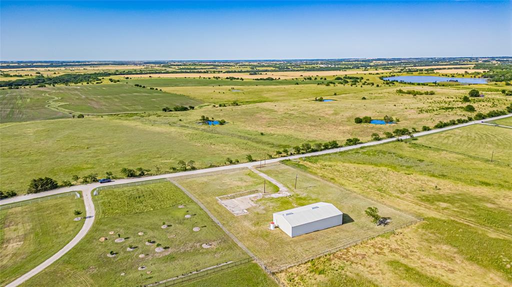 Aerial view of sparsely populated area featuring a large body of water
