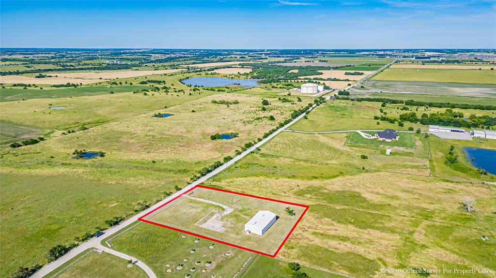 16634 Celina Road Celina, TX 75009 - Photo 15 of 22 Aerial view of sparsely populated area featuring a nearby body of water and property boundaries highlighted