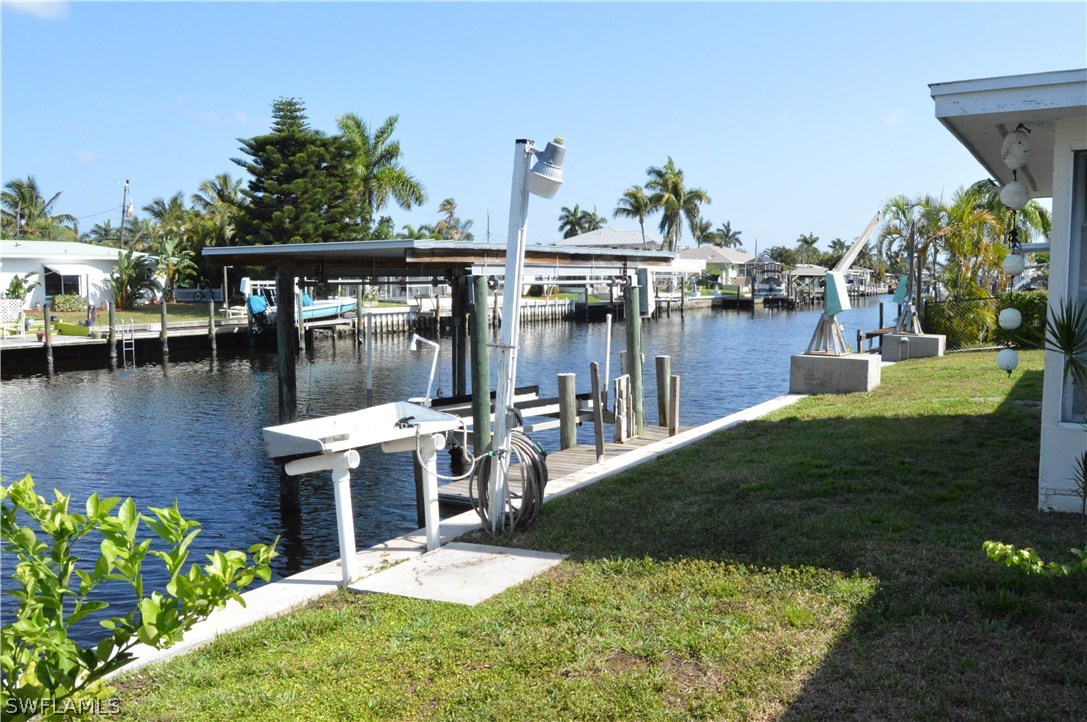 2822 Bruce Street Cape Coral, FL 33993 - Photo 3 of 20 a view of a swimming pool with a patio and garden
