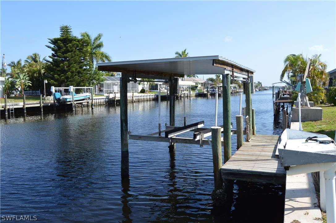 2822 Bruce Street Cape Coral, FL 33993 - Photo 4 of 20 a dinning table and chairs in the patio
