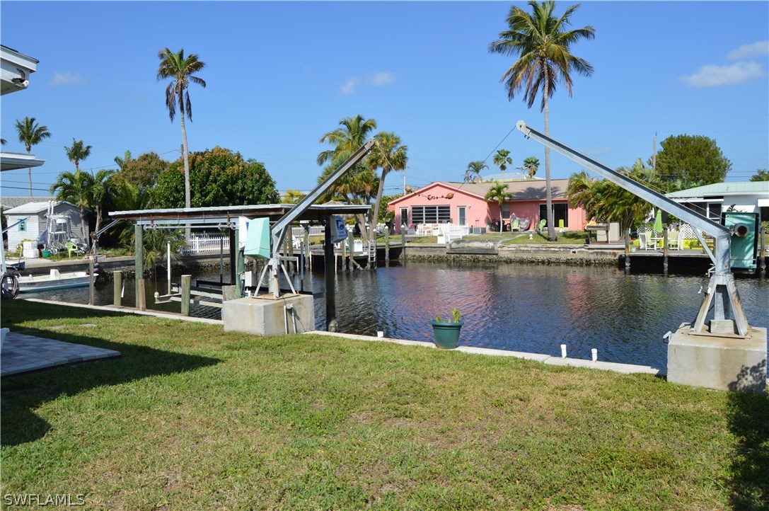 2822 Bruce Street Cape Coral, FL 33993 - Photo 9 of 20 a front view of a house with a lake view