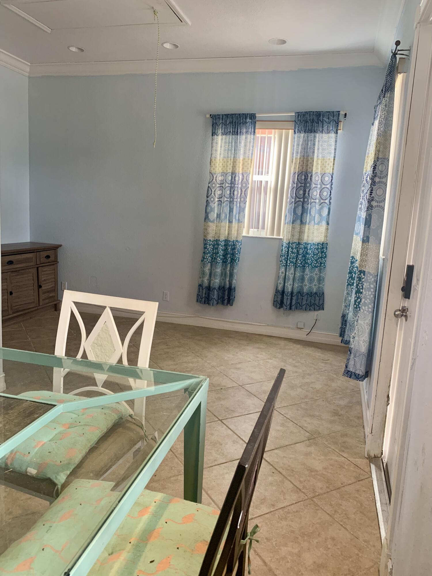 2215 Hypoluxo Road Lantana, FL 33462 - Photo 12 of 49 a view of a livingroom with furniture and door