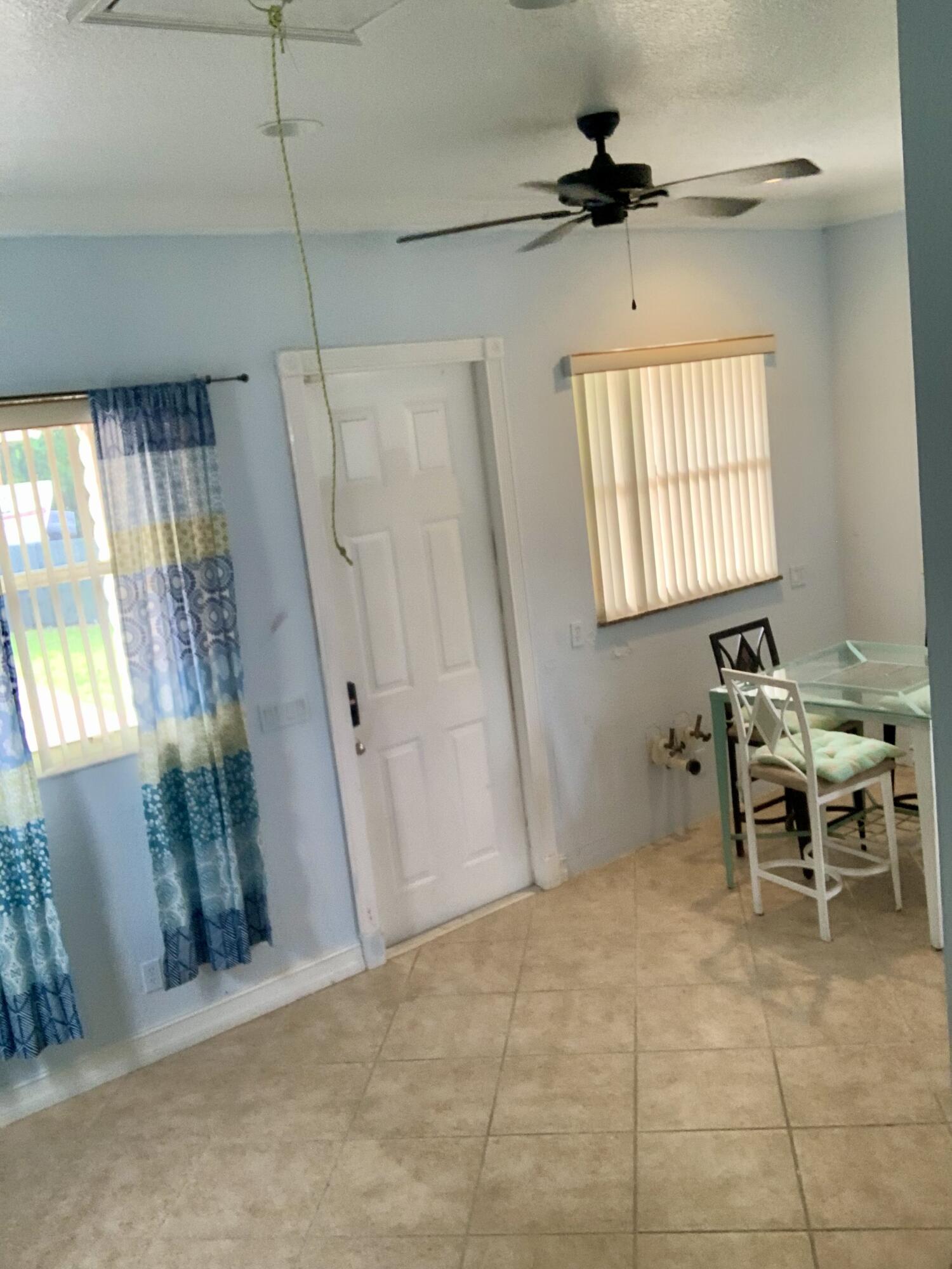 2215 Hypoluxo Road Lantana, FL 33462 - Photo 14 of 49 a view of a livingroom with furniture and a window