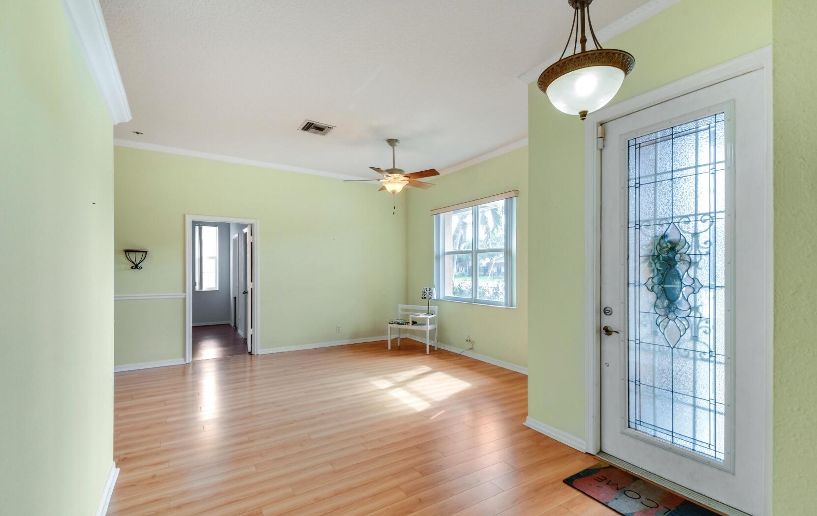 2215 Hypoluxo Road Lantana, FL 33462 - Photo 21 of 49 a view of empty room with wooden floor and fan
