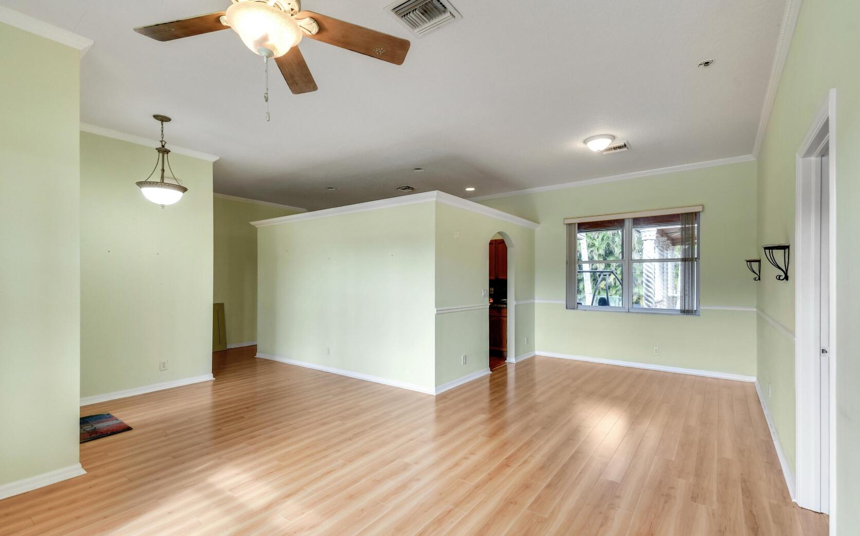 2215 Hypoluxo Road Lantana, FL 33462 - Photo 22 of 49 a view of livingroom with hardwood floor and window