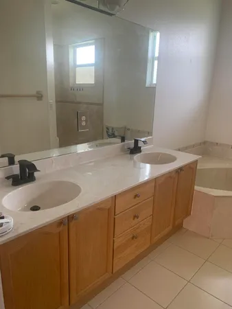 a bathroom with a sink and vanity