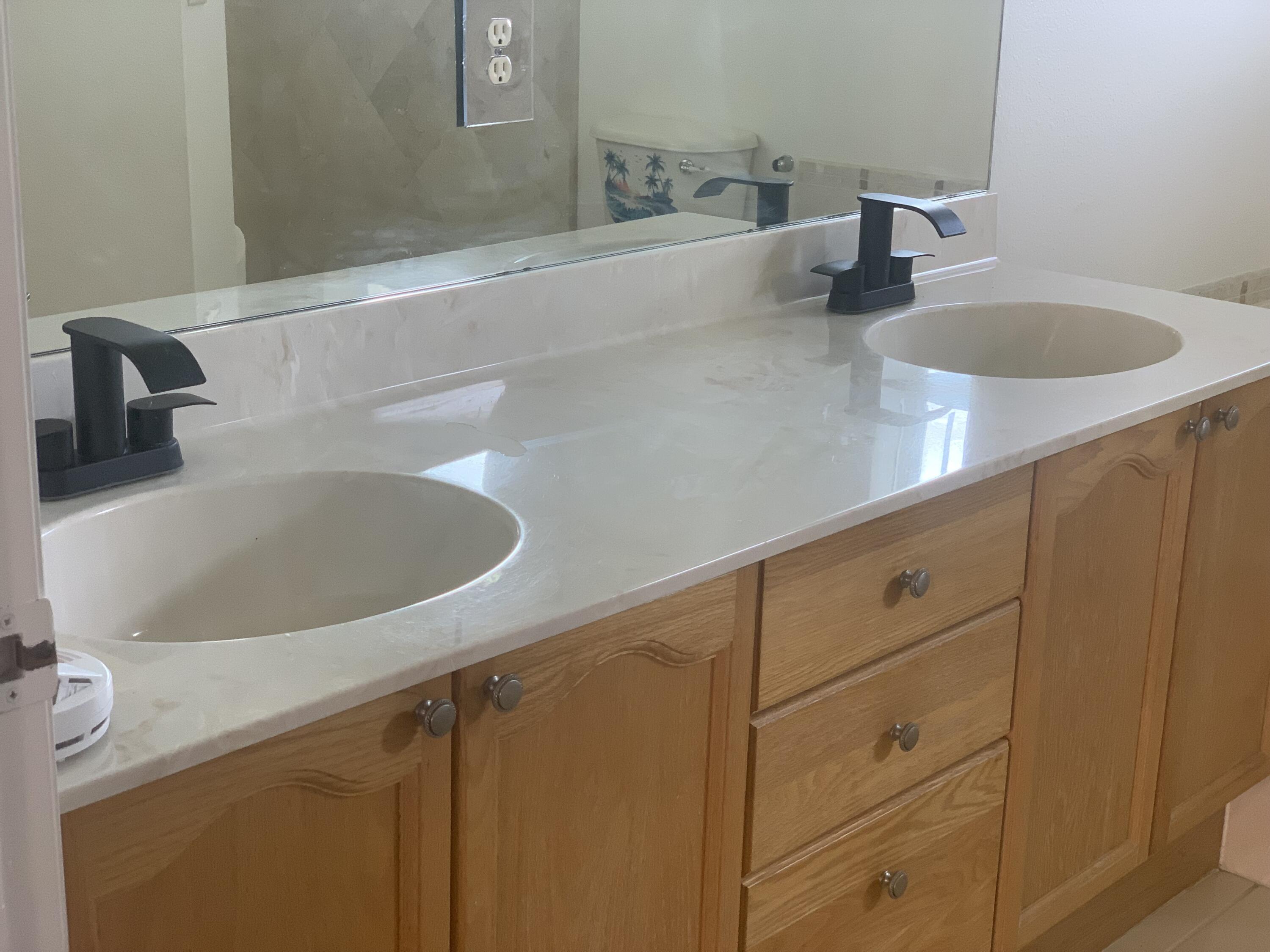 2215 Hypoluxo Road Lantana, FL 33462 - Photo 34 of 49 a bathroom with a sink and vanity