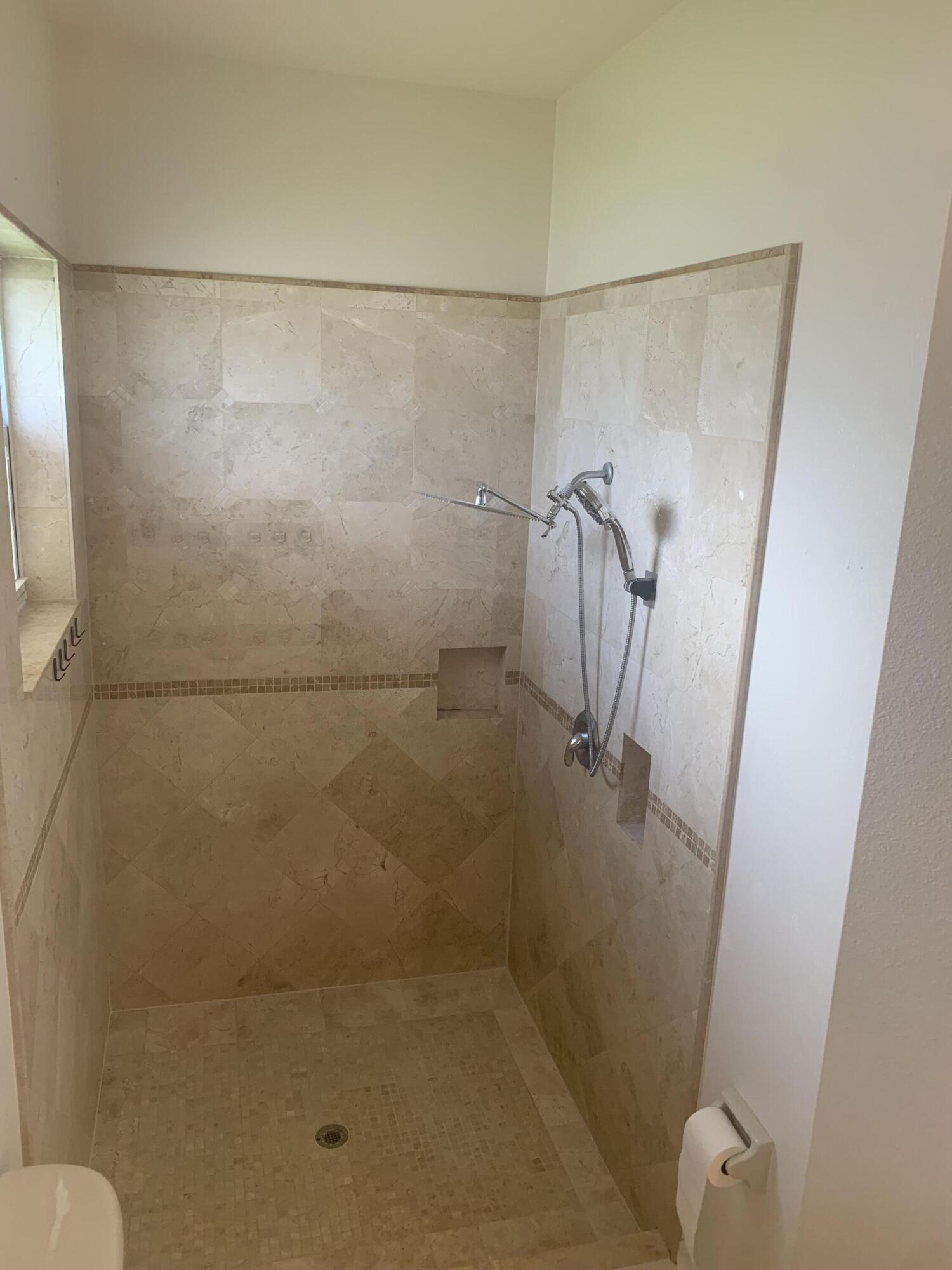 2215 Hypoluxo Road Lantana, FL 33462 - Photo 36 of 49 a bathroom with a shower