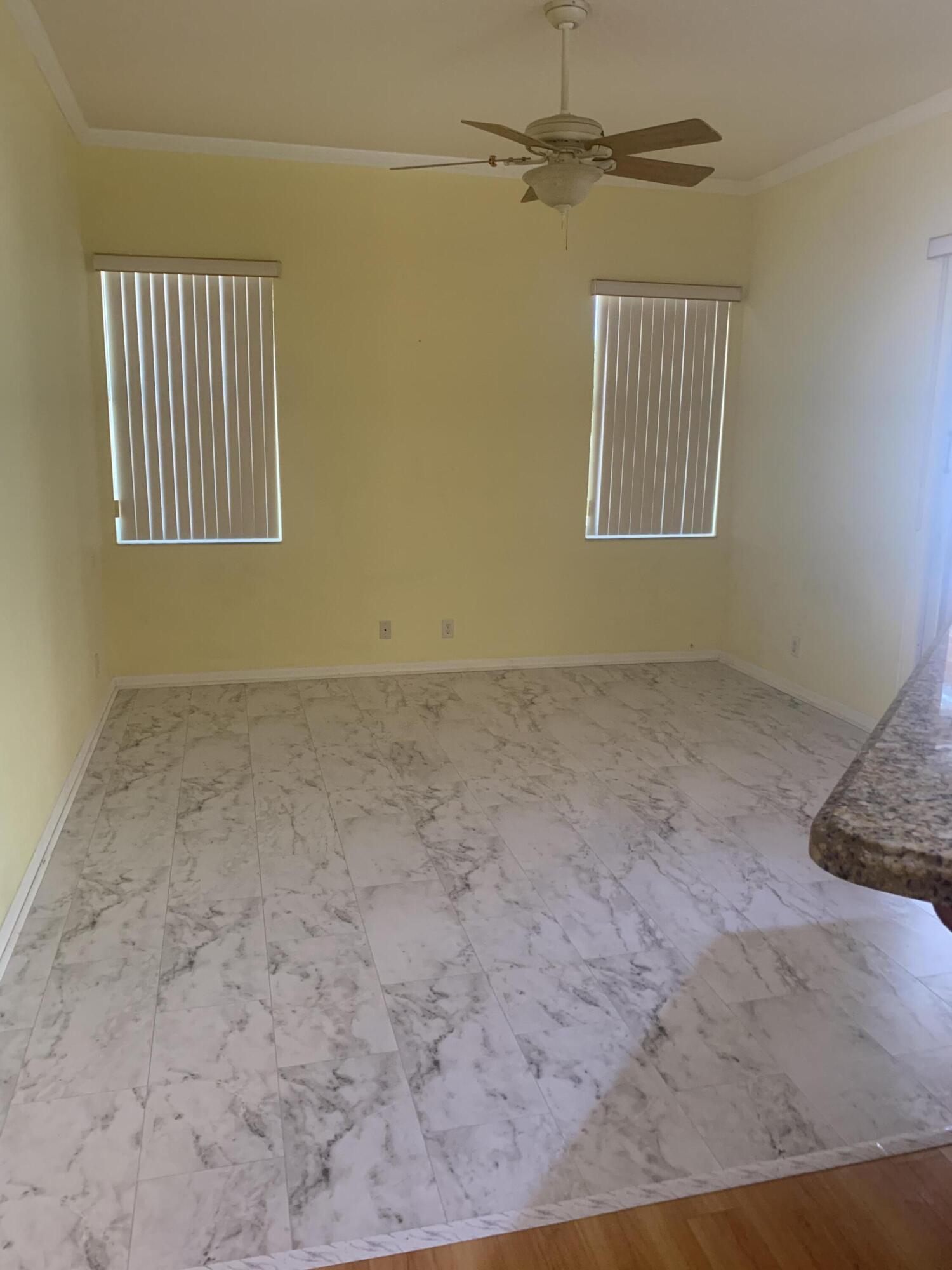 2215 Hypoluxo Road Lantana, FL 33462 - Photo 38 of 49 an empty room with windows