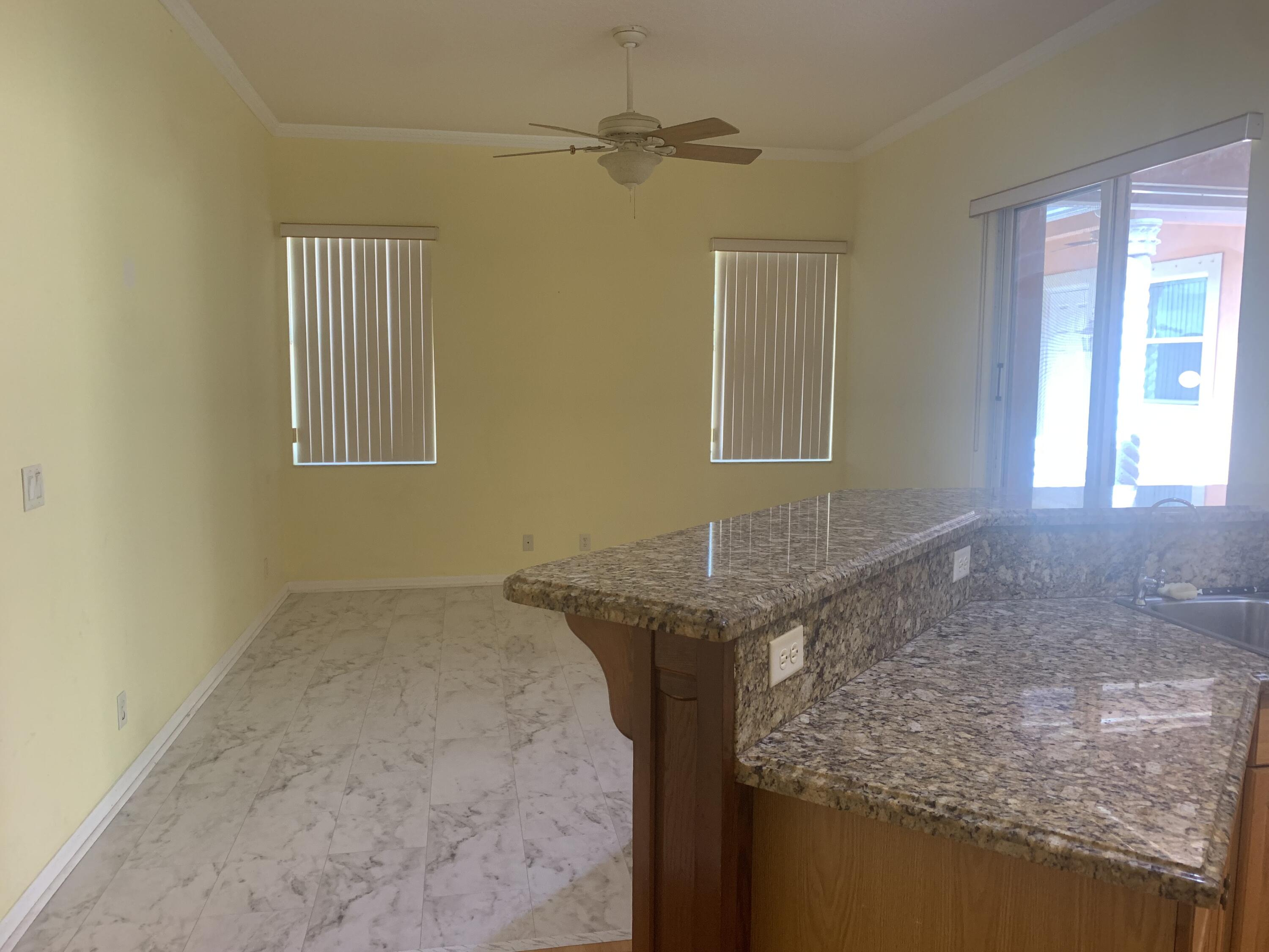 2215 Hypoluxo Road Lantana, FL 33462 - Photo 39 of 49 a bathroom with a granite countertop sink and a mirror