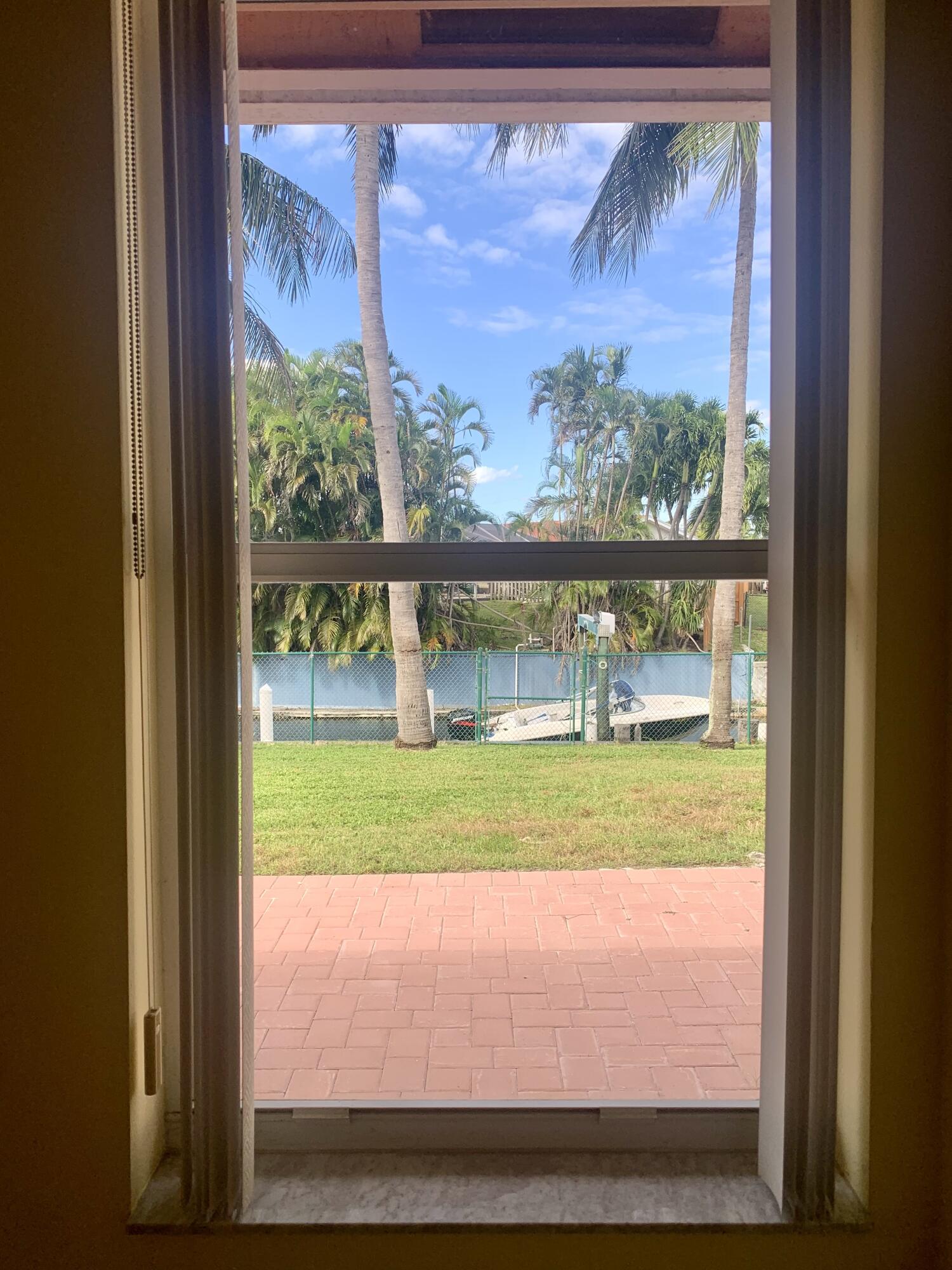 2215 Hypoluxo Road Lantana, FL 33462 - Photo 42 of 49 a view of back yard from a window