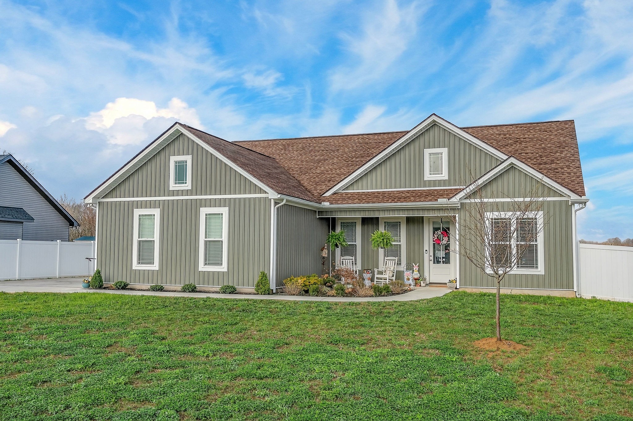1073 Arch Cope Road Morrison, TN 37357 - Photo 2 of 42 a front view of a house with garden