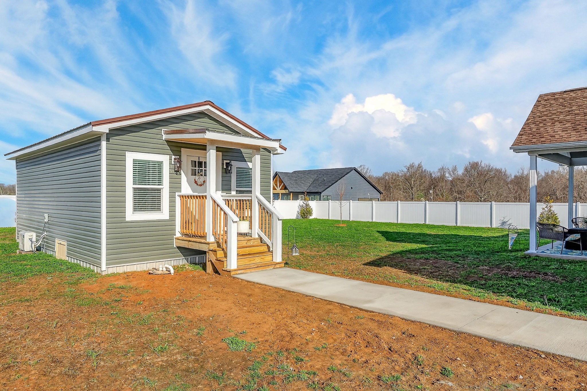 1073 Arch Cope Road Morrison, TN 37357 - Photo 32 of 42 a view of a house with a yard and wooden fence