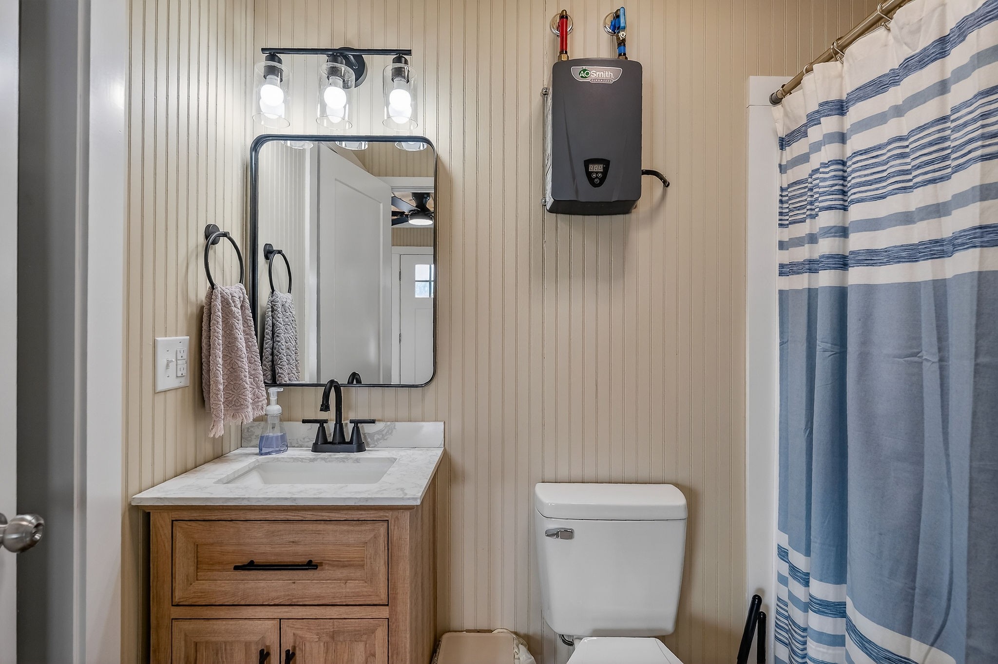 1073 Arch Cope Road Morrison, TN 37357 - Photo 34 of 42 a bathroom with a sink a toilet and mirror