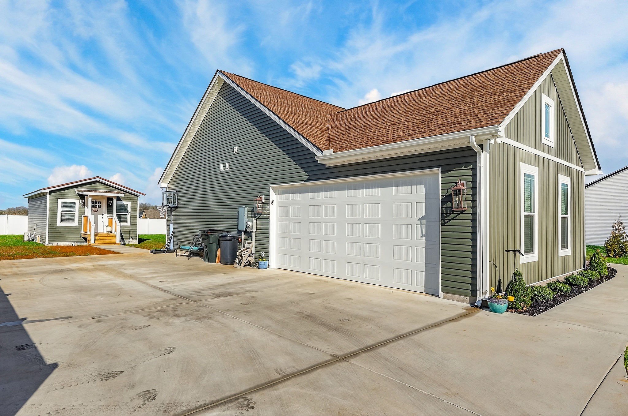 1073 Arch Cope Road Morrison, TN 37357 - Photo 39 of 42 a front view of a house with a yard and garage