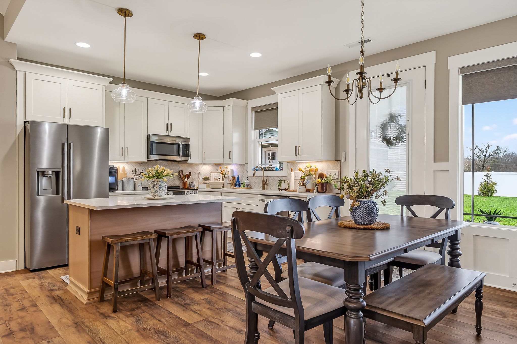 1073 Arch Cope Road Morrison, TN 37357 - Photo 10 of 42 a kitchen with kitchen island a dining table chairs stainless steel appliances and cabinets