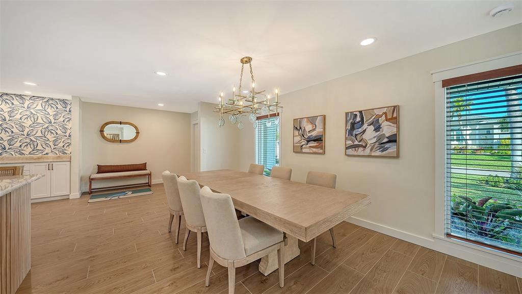690 Old Compass Road Longboat Key, FL 34228 - Photo 14 of 69 a view of a dining room with furniture and chandelier