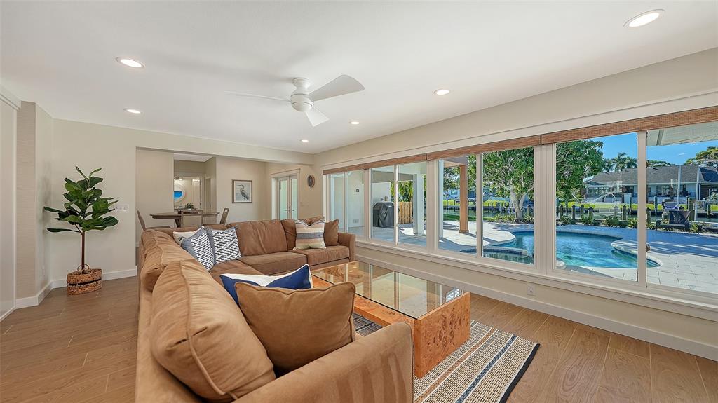 690 Old Compass Road Longboat Key, FL 34228 - Photo 21 of 69 a living room with furniture and a large window