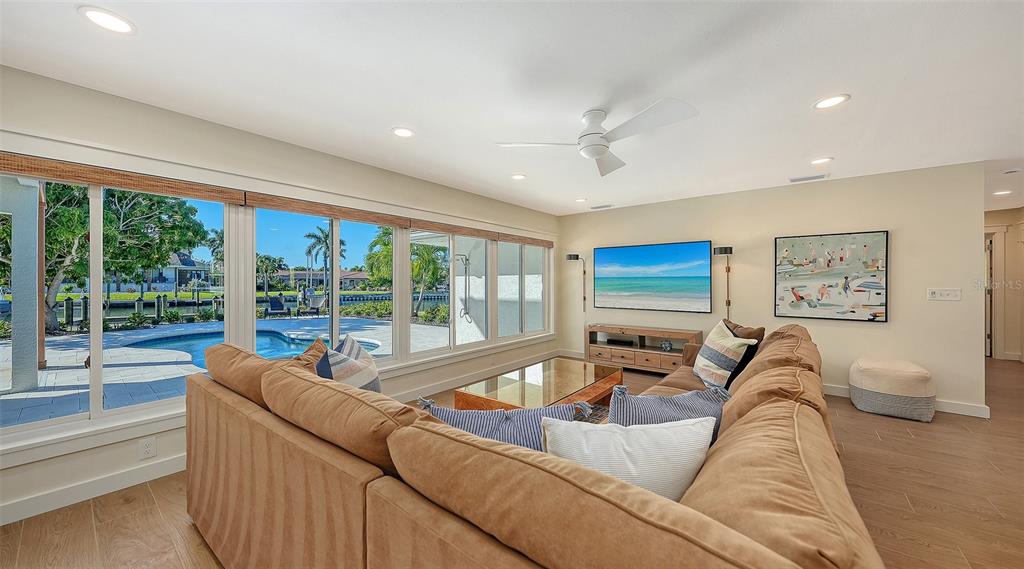 690 Old Compass Road Longboat Key, FL 34228 - Photo 25 of 69 a living room with furniture and a large window