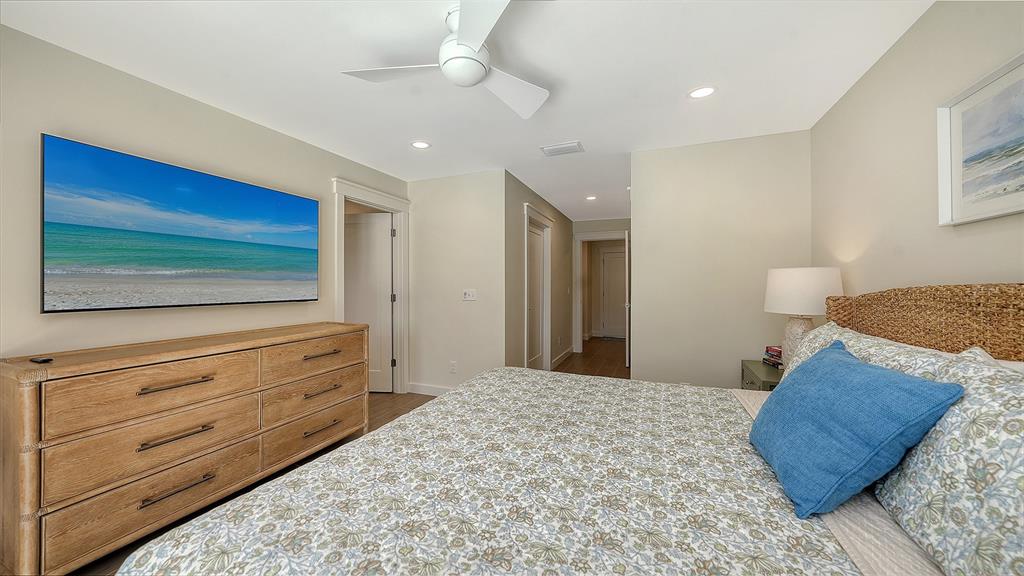 690 Old Compass Road Longboat Key, FL 34228 - Photo 32 of 69 a bedroom with a bed and a flat screen tv