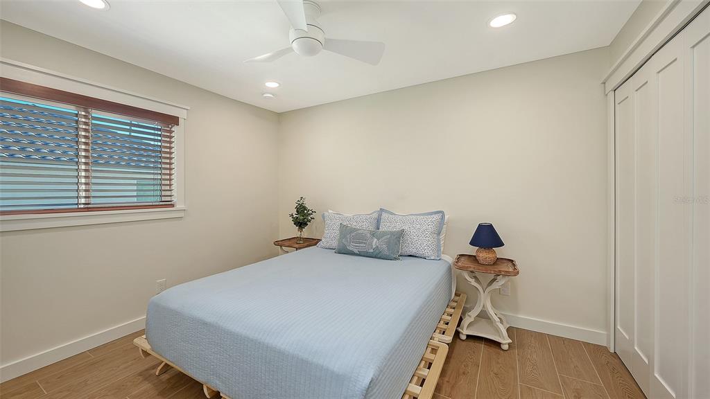 690 Old Compass Road Longboat Key, FL 34228 - Photo 37 of 69 a bedroom with a bed and a window