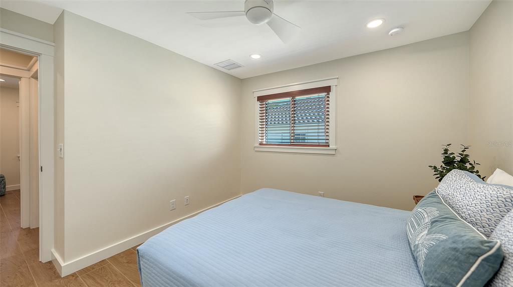 690 Old Compass Road Longboat Key, FL 34228 - Photo 38 of 69 a bedroom with a bed and a window