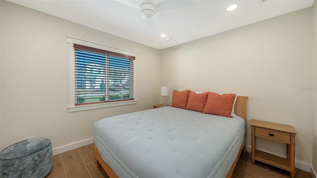 690 Old Compass Road Longboat Key, FL 34228 - Photo 43 of 69 a bedroom with a bed and a window