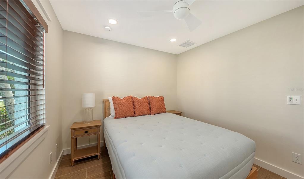 690 Old Compass Road Longboat Key, FL 34228 - Photo 44 of 69 a bed room with a bed and a large window