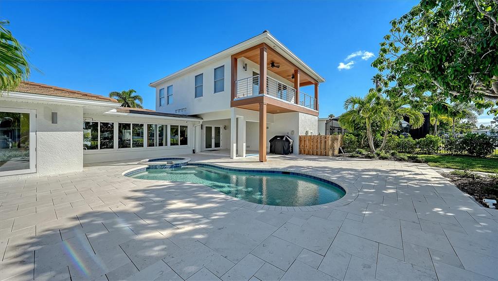 690 Old Compass Road Longboat Key, FL 34228 - Photo 54 of 69 a front view of a house with swimming pool