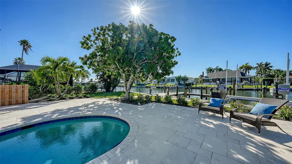 690 Old Compass Road Longboat Key, FL 34228 - Photo 60 of 69 a view of swimming pool with a patio and a yard