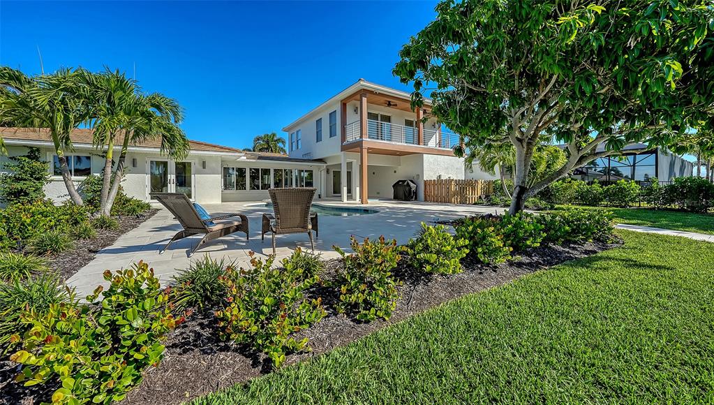 690 Old Compass Road Longboat Key, FL 34228 - Photo 63 of 69 a front view of a house with a yard