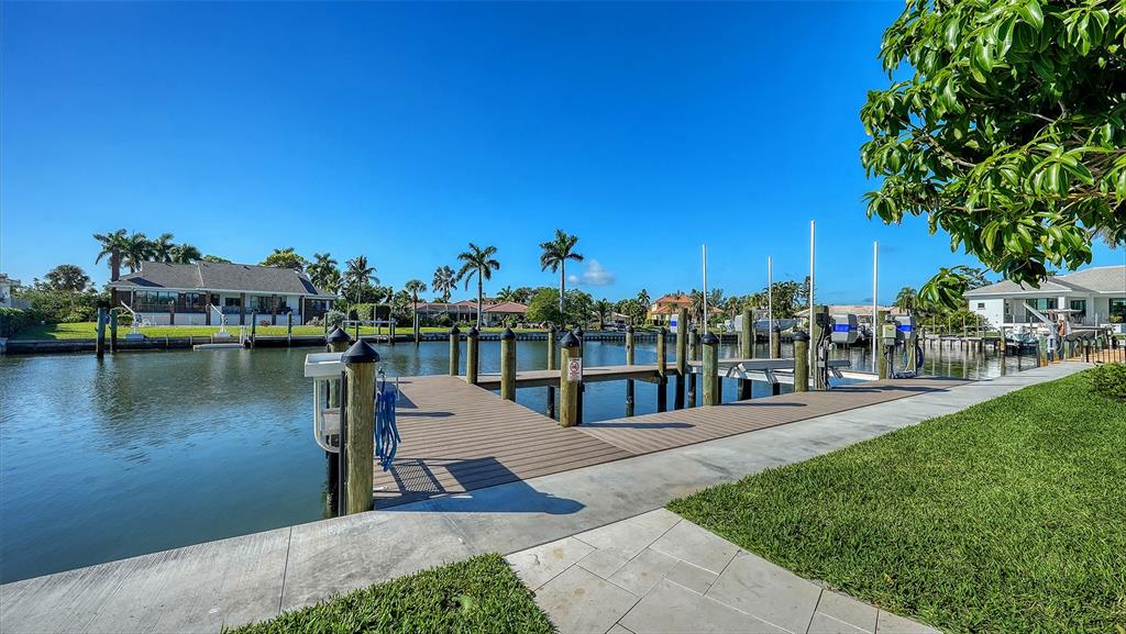 690 Old Compass Road Longboat Key, FL 34228 - Photo 65 of 69 a view of a lake with a house