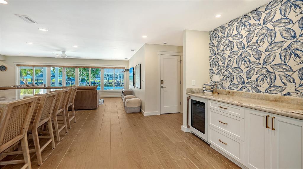 690 Old Compass Road Longboat Key, FL 34228 - Photo 10 of 69 a living room with furniture and wooden floor