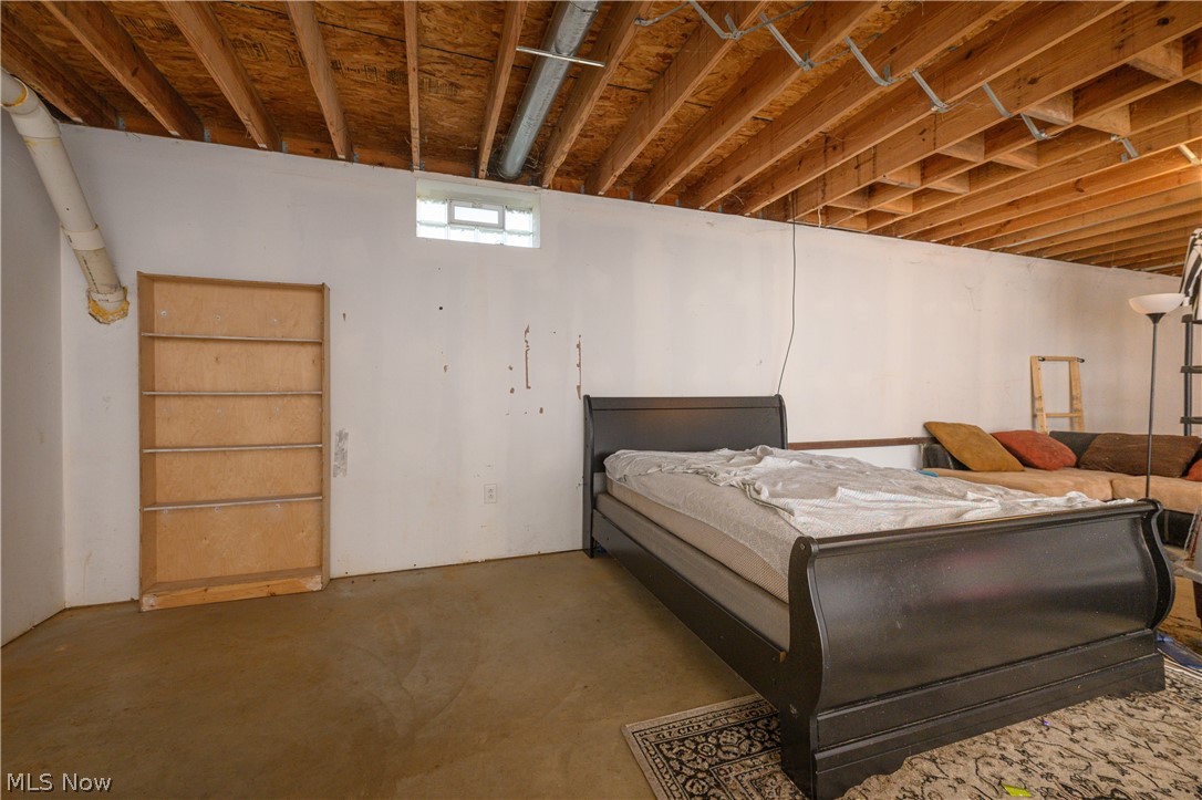 8200 Cutler Road Southwest Sherrodsville, OH 44675 - Photo 25 of 26 Bedroom with concrete flooring