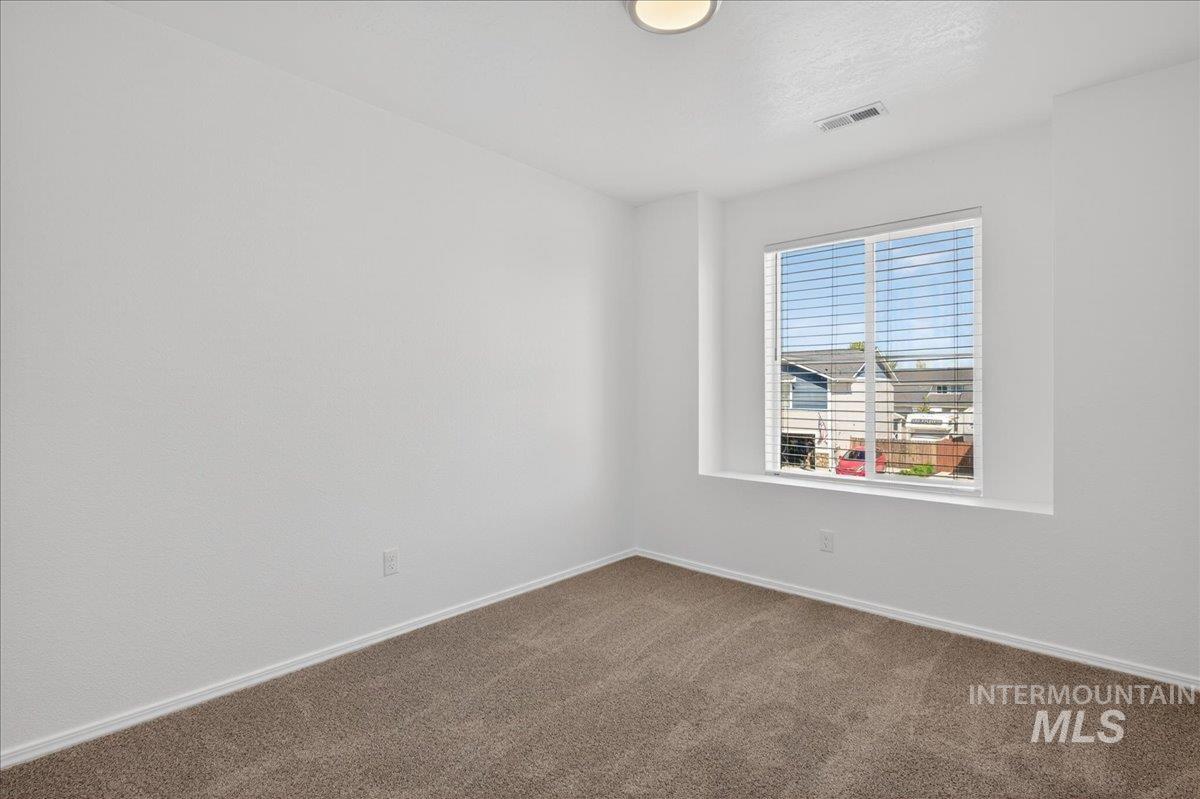 913 West Apple Pine Street Meridian, ID 83646 - Photo 18 of 32 Carpeted room featuring a single window with blinds, white walls, and a flush-mount ceiling light