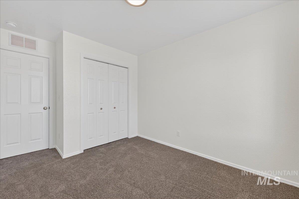913 West Apple Pine Street Meridian, ID 83646 - Photo 19 of 32 Neutral wall tones complement the durable carpet flooring