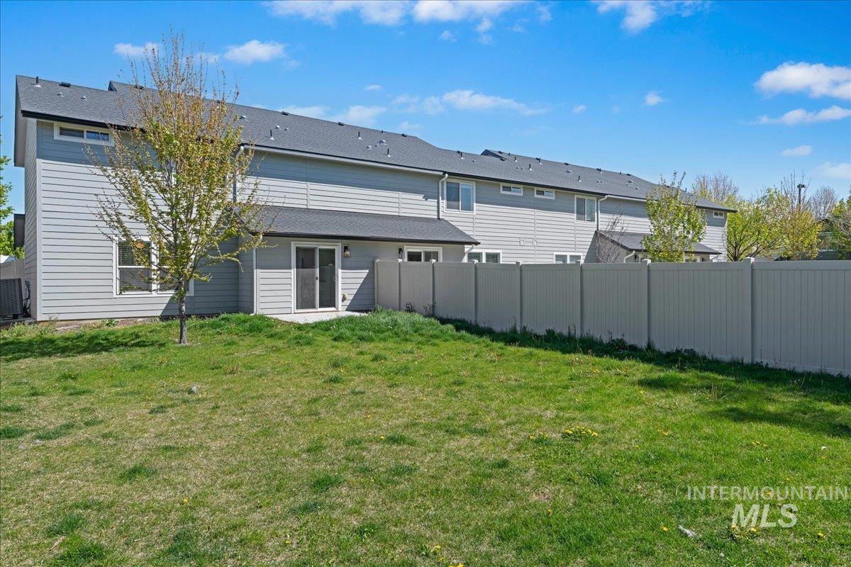 913 West Apple Pine Street Meridian, ID 83646 - Photo 27 of 32 Rear exterior featuring grey siding, a sliding glass door, and a concrete patio