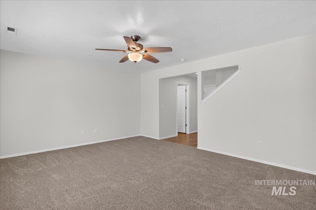 913 West Apple Pine Street Meridian, ID 83646 - Photo 7 of 32 Spacious room featuring neutral carpeting and light-toned walls