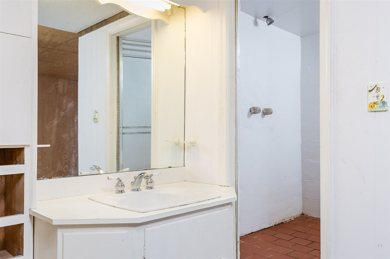 1318 Kent Road Raleigh, NC 27606 - Photo 26 of 28 Rear storage area with potential shower and sink