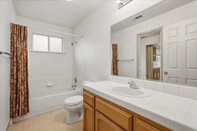 a bedroom with bed and window