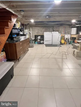 a kitchen with granite countertop a sink and a stove top oven
