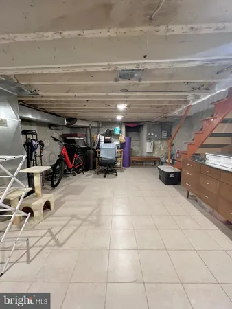 a view of parking garage with cars and other equipment