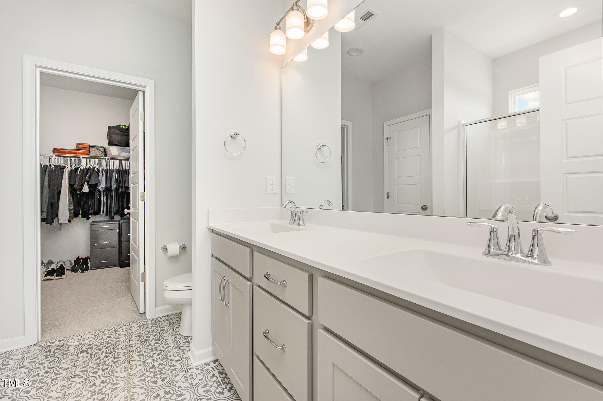 1101 Hazelmist Drive Wake Forest, NC 27587 - Photo 14 of 28 a bathroom with a sink double vanity and shower
