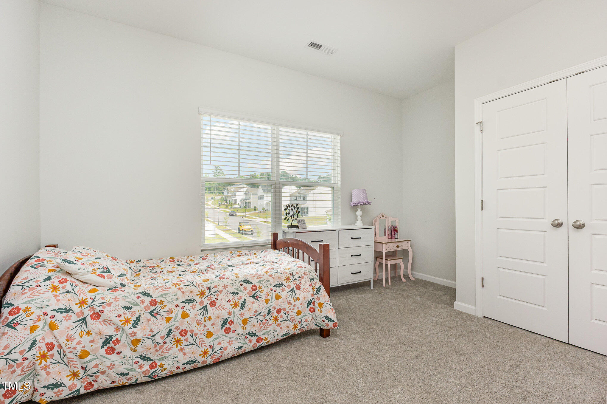 1101 Hazelmist Drive Wake Forest, NC 27587 - Photo 15 of 28 a bedroom with a bed and a closet