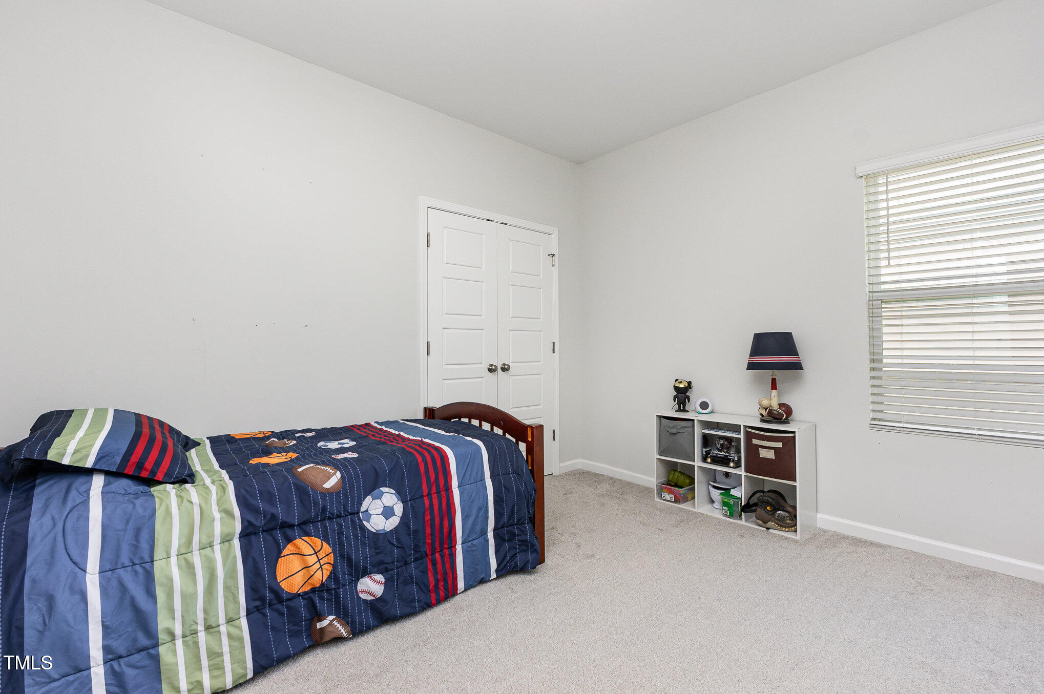 1101 Hazelmist Drive Wake Forest, NC 27587 - Photo 21 of 28 a bedroom with a bed and a dresser